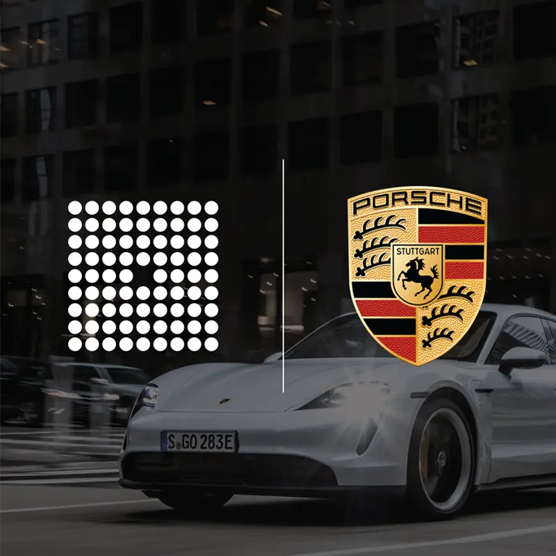 Group14 and Porsche's 
logos pictured atop an image of a car